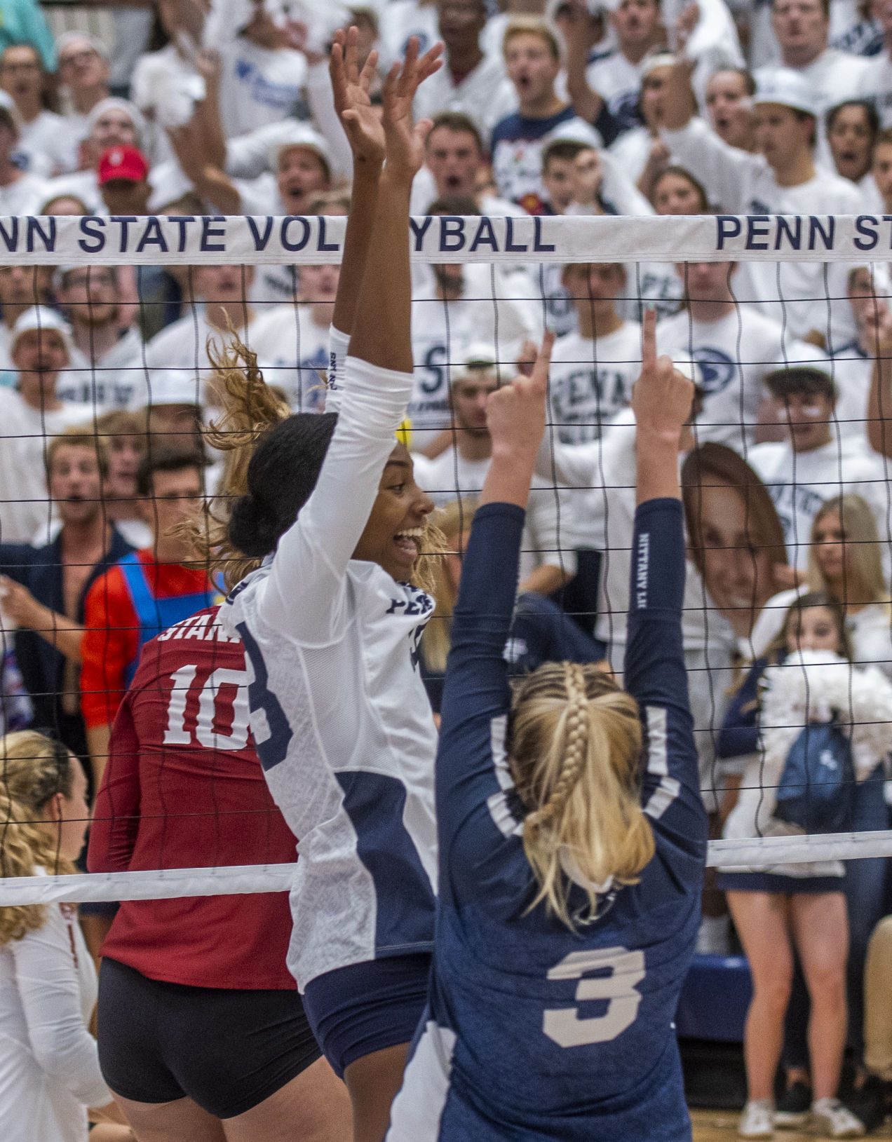 Penn State women's volleyball vs Stanford, Kaitlyn Hord (23) and Kendall White (3) celebrate